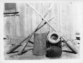 Photograph: Wood Mortars and Pestles and an Iron pot.