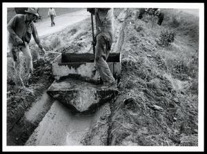 Primary view of object titled 'Lining Small Irrigation Ditch'.
