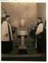 Photograph: Rev. Eckel and Bishop Casady at Baptismal Font