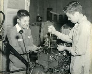 Here Two Prospective Mechanics Are Tuning Up One Of The Trainee Cars.