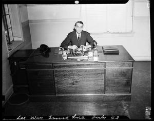 Man Seated at Desk