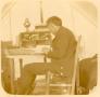 Thumbnail image of item number 1 in: 'Grant Foreman at his tent desk in the field.'.