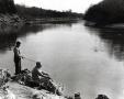 Photograph: Two men fishing on a riverbank in Johnston County.