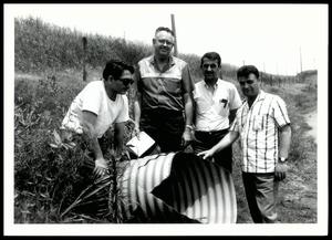 Tom Wharton Alongside Three Turkish Agricultural Engineers Posing Next to a Drainage Pipe