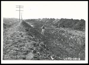 UNIDENTIFED Man Checking the Berm and Side Slope of an Unspread Spoil