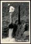 Photograph: UNIDENTIFED Man Standing on Top of the Lower End of a Discharge Pipe …