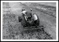 Thumbnail image of item number 1 in: 'UNIDENTIFED Man Renovating Bermudagrass with Cultivator'.