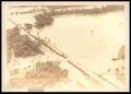 Thumbnail image of item number 1 in: 'Damaged Road Spanning A Flooded Wildhorse Creek'.