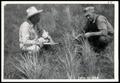 Thumbnail image of item number 1 in: 'Eldred and Wilson Studying Grass Growth on 80-Acre Field Seeded to Native Grass Mixture'.