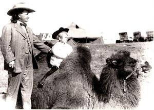 Pawnee Bill and Child Riding a Camel