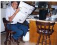 Photograph: Man Reading a Newspaper