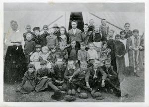Primary view of object titled 'First School in Tent Enid with Students'.