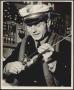 Photograph: Police officer with fishing pole