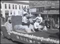 Thumbnail image of item number 1 in: 'High School Cheerleaders Part of 1938 Parade'.