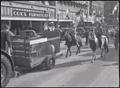 Photograph: Cowboys Following a Tractor During 1938 Parade