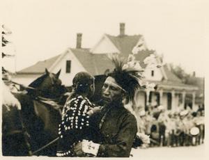 Native American Holding Child