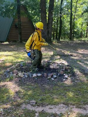 Boy Cleaning Campsite
