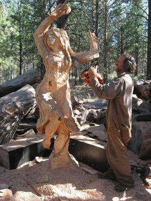 Artist Creating a Wooden Sculpture