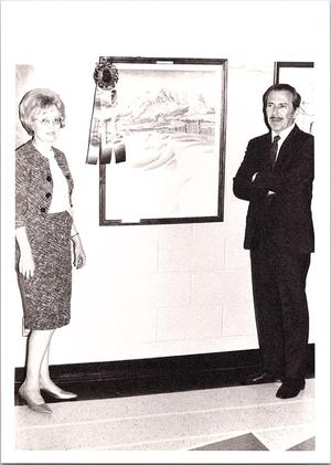 Unknown Woman and Man Next to Prized Painting