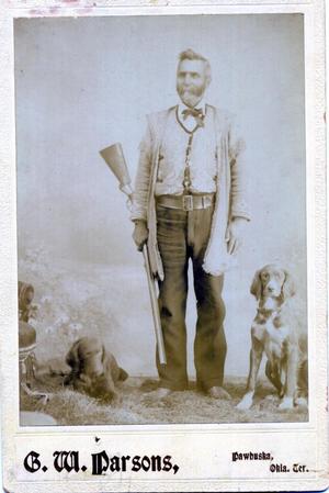 Unknown man and his two dogs