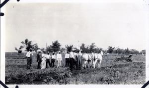 Group of Men in a Field