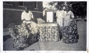 African-American Women Work With Upholstery Fabrics